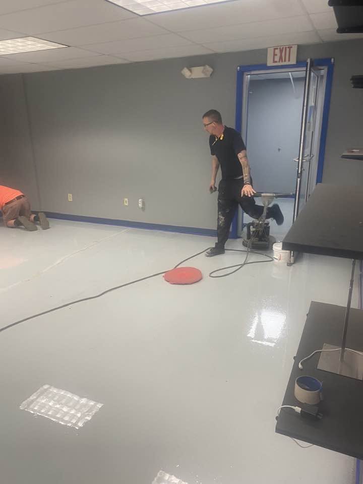 Quality Hardwood Floors crew finishing the Ford project